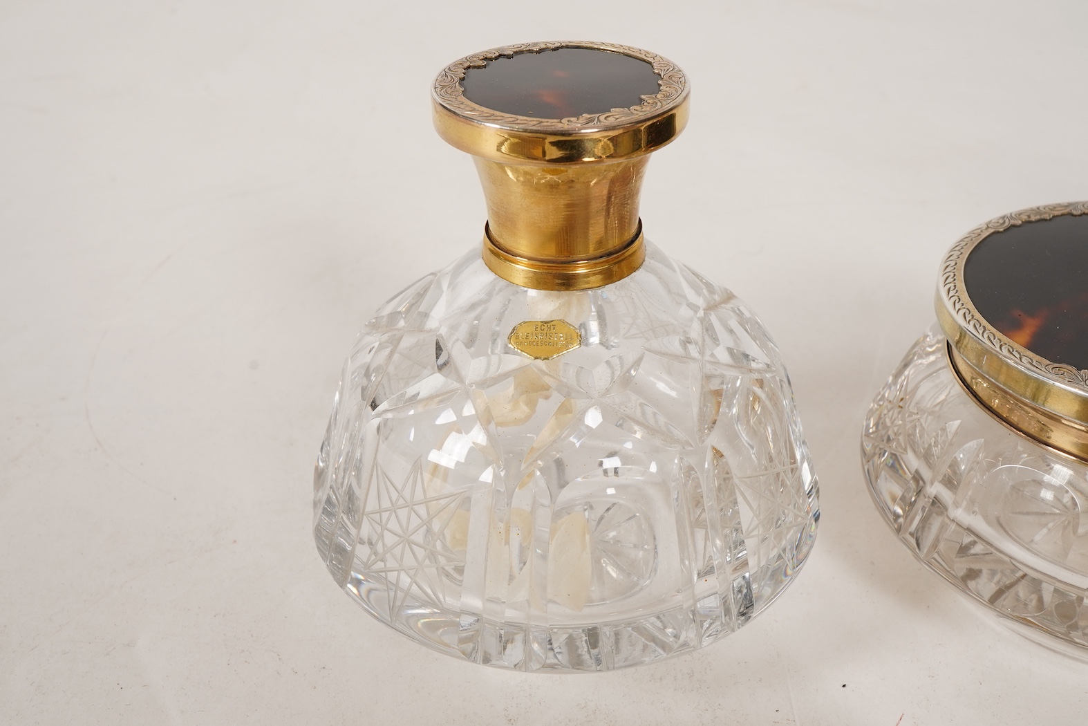 A mid 20th century continental eight piece gilt white metal and tortoiseshell mounted dressing table set